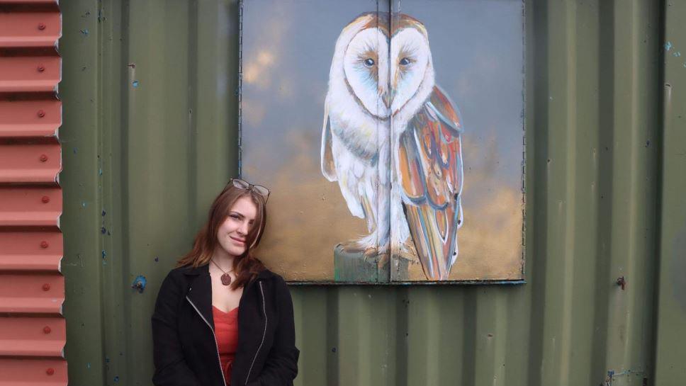 Artist with barn owl mural in Louth 