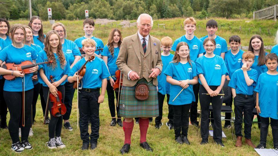 King Charles with local children