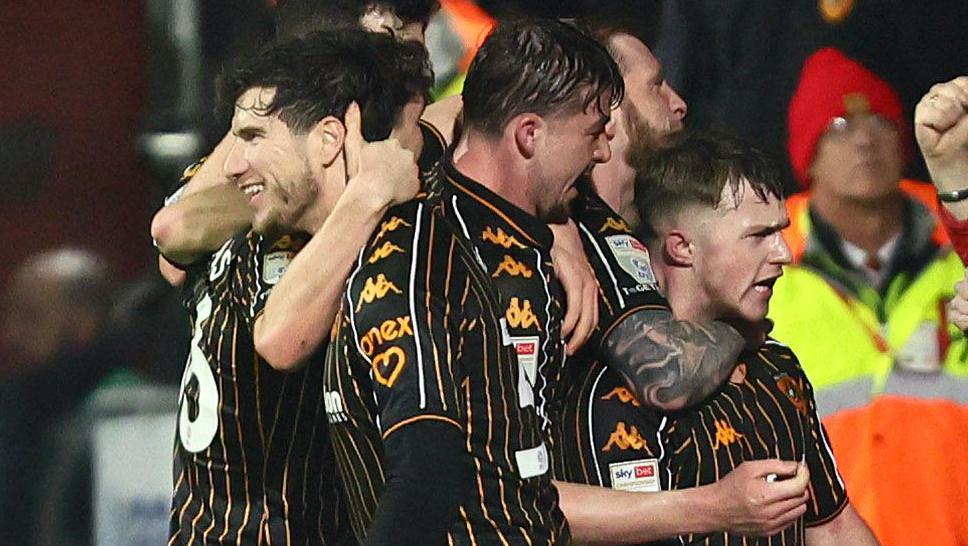 Hull City players celebrate with goal scorer Joe Gelhardt (right)