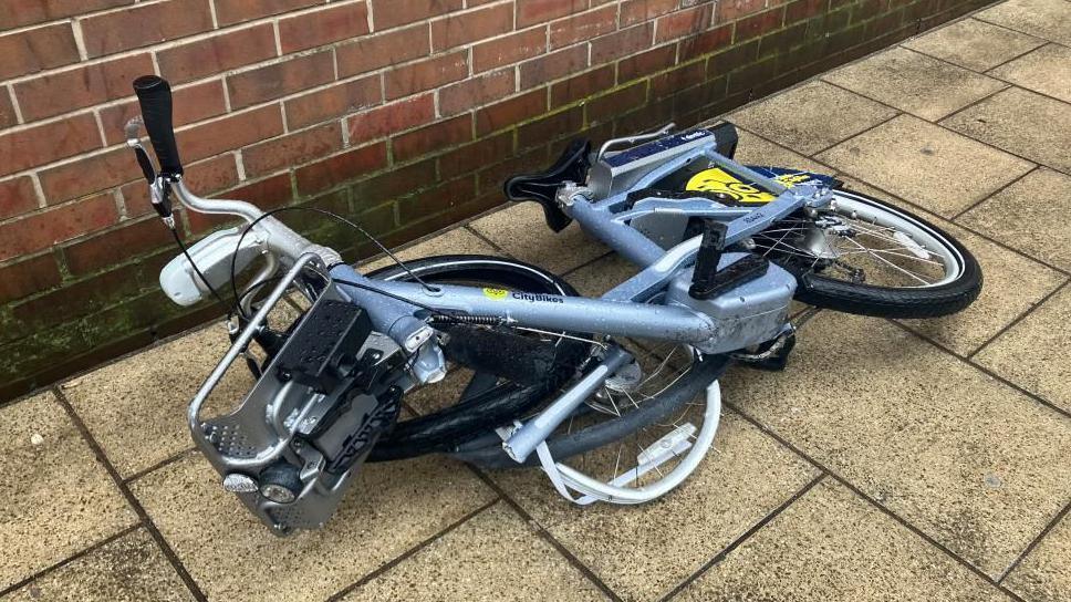 A vandalised bike on the street in Leeds City Centre