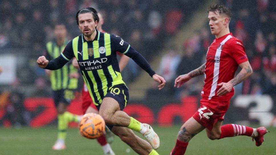 Manchester City's Jack Grealish challenges Ethan Galbraith in the FA Cup win at Leyton Orient