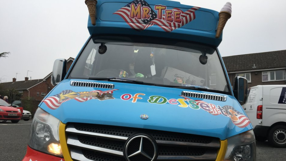 Mr Tee's blue ice cream van, parked in a street