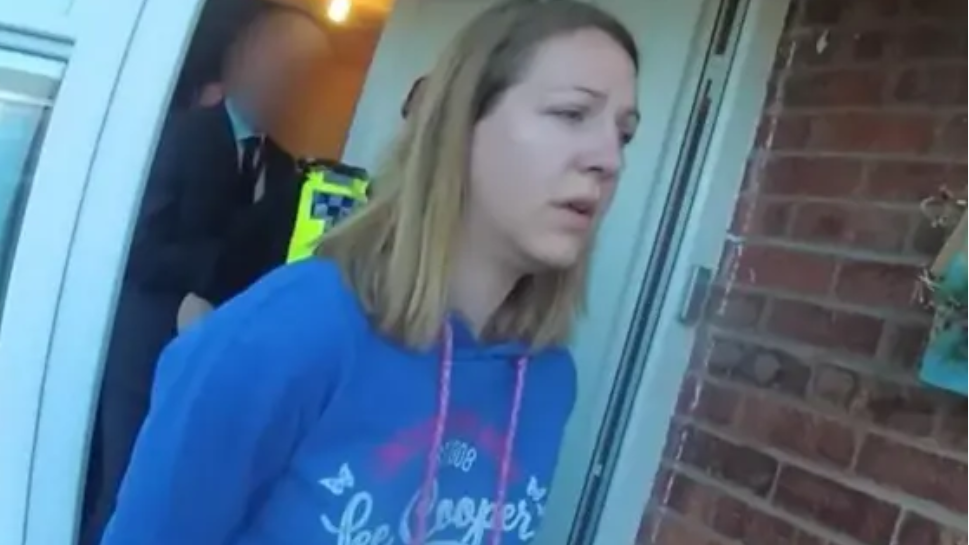 Lucy Letby, pictured in a blue top, during her arrest at her home in 2018.