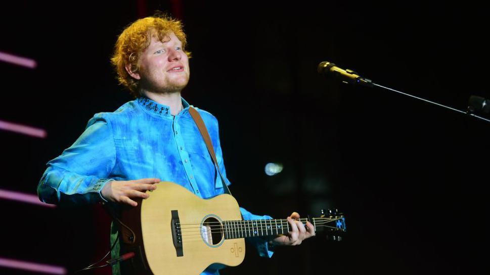 British singer and songwriter Ed Sheeran performs during a concert in Mumbai on November 19, 2017. 