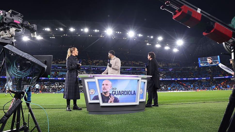 Laura Woods presents coverage on TNT Sports alongside pundits, Joleon Lescott and Owen Hargreaves