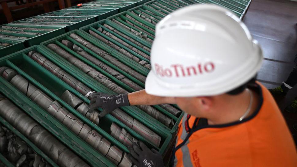 An employee works on sample trays of jadarite, containing lithium and borate, at the Rio Tinto Group research center in Loznica, Serbia, on Friday, July 12, 2024