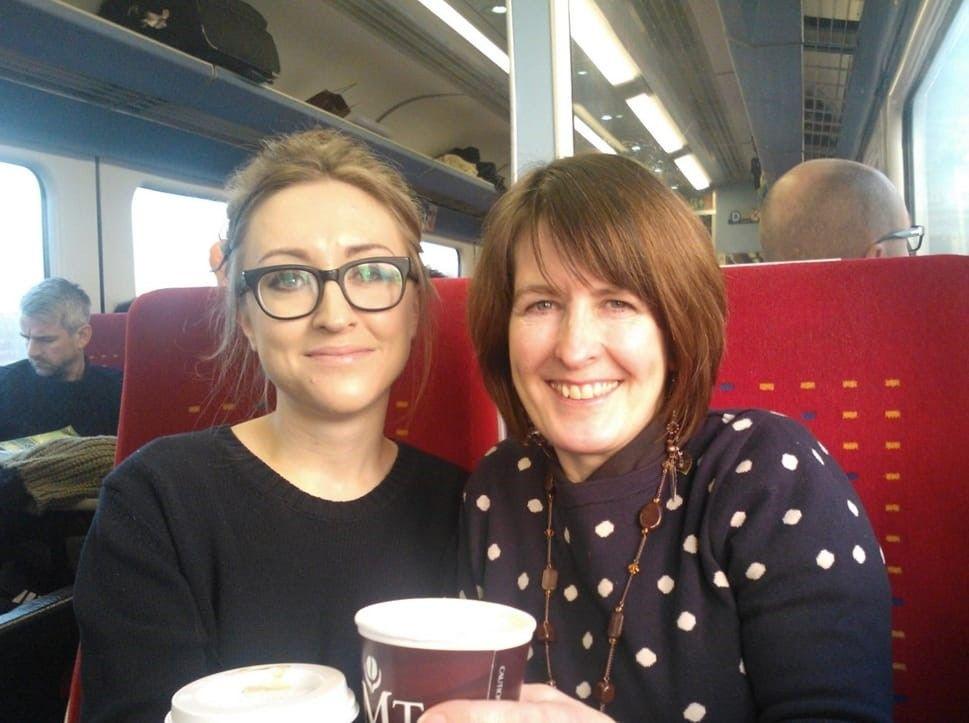 Louise Wright sat on a train with her mum Sharon Brown