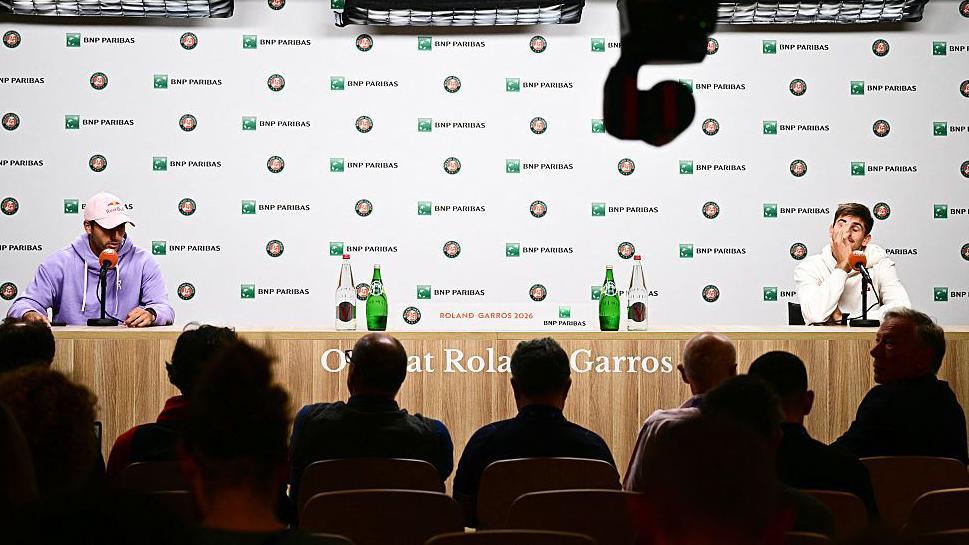 Flavio Cobolli and Matteo Arnaldi sit apart at their French Open news conference