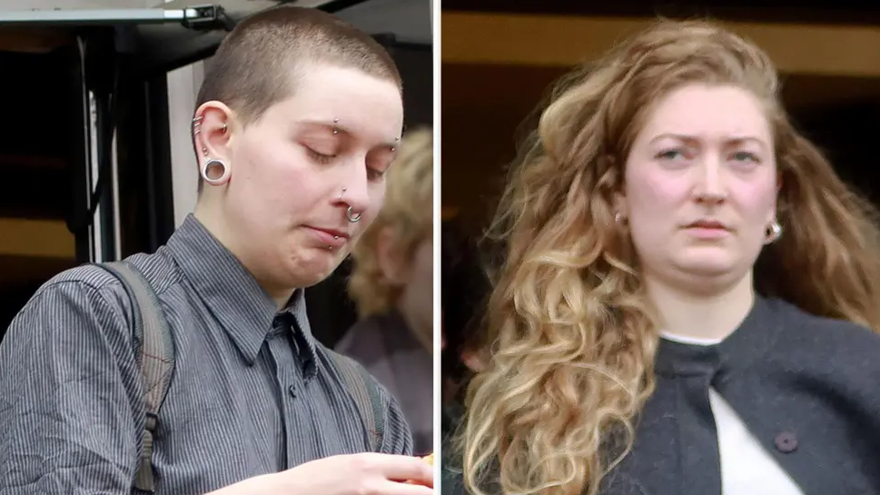 Hannah Taylor and Sarah Martin leaving an earlier court hearing. Taylor has close-cropped dark hair and has several piercings in her ears and nose. Martin his long, wavy fair hair and his wearing a black jacket over white top