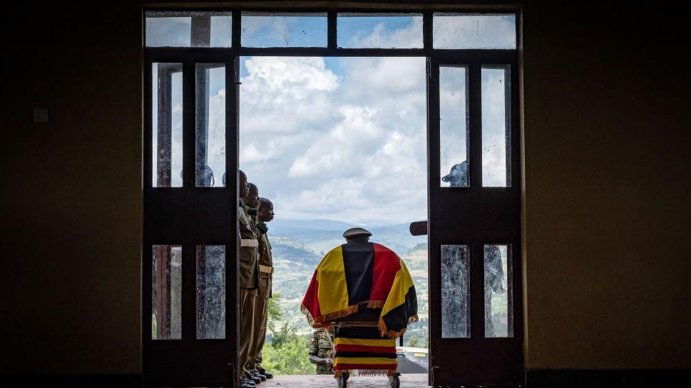 An image of Ugandan athlete Rebecca Cheptegei's casket in a hall with soldiers flanking both sides, so people can pay their respects before her funeral in Bukwo district in Uganda - Saturday 14 September 2024.