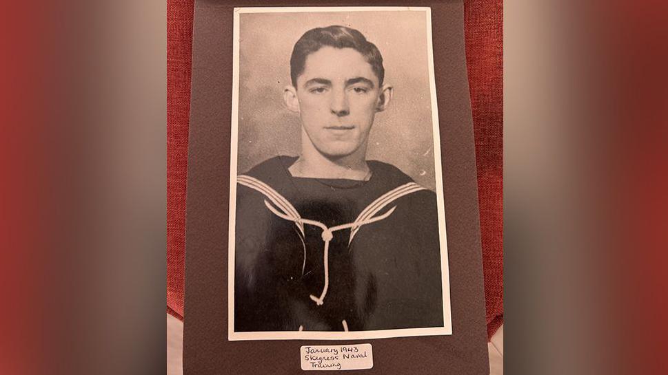 Photograph of Tom Berry, taken in 1943, during his naval training in Skegness, Lincolnshire. He is pictured wearing his navy uniform.