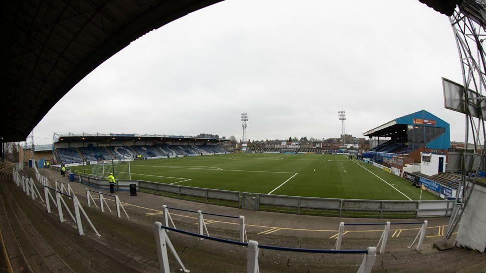 Palmerston Park football ground in Dumfries with an artificial playing surface and two stands on either side