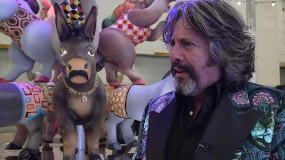 Laurence Llewelyn-Bowen standing next to his donkey tableau he designed for the Blackpool Illuminations