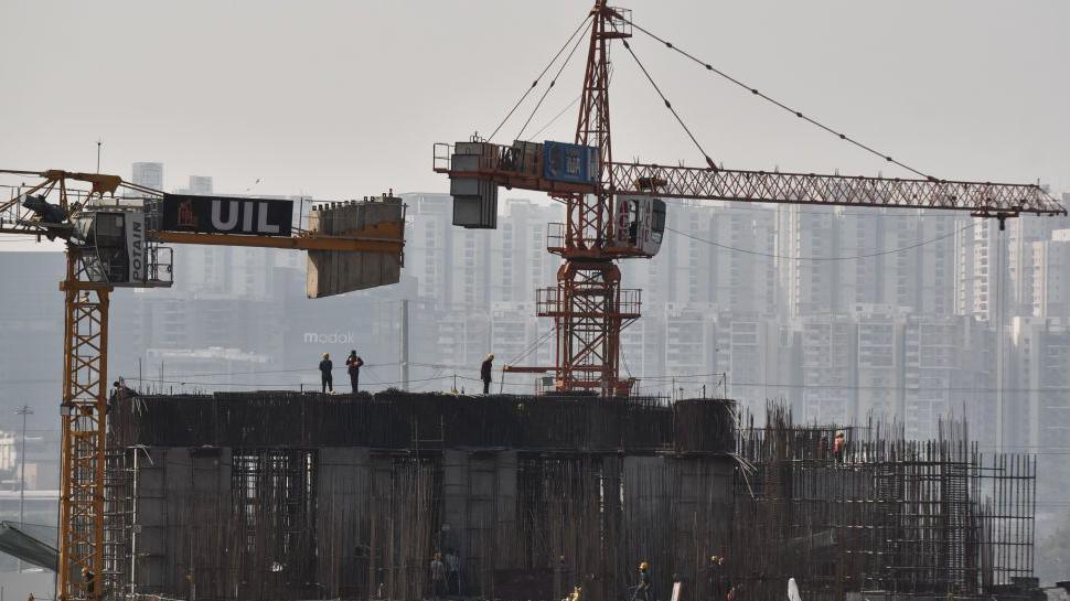 Indian construction workers work on a high-rise building. India's prime minister, Narendra Modi, presents the Union Budget 2025-26 in parliament in Hyderabad, India, on January 30, 2025.