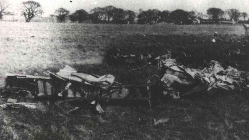 A black and white image of the wreckage of two planes