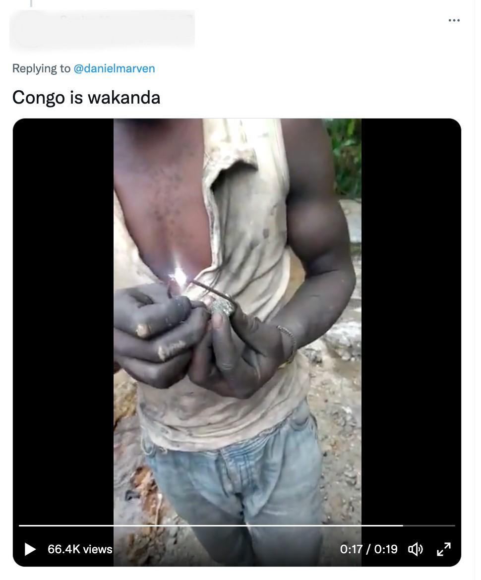 Video grab of man apparently lighting an LED lamp using wires from a piece of rock