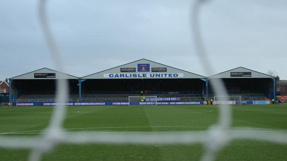 A view of the Warwick Road End through the nets at Carlisle United's Brunton Park ground