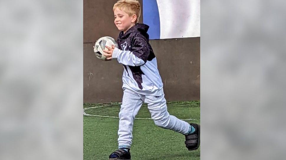 A young boy with a club food