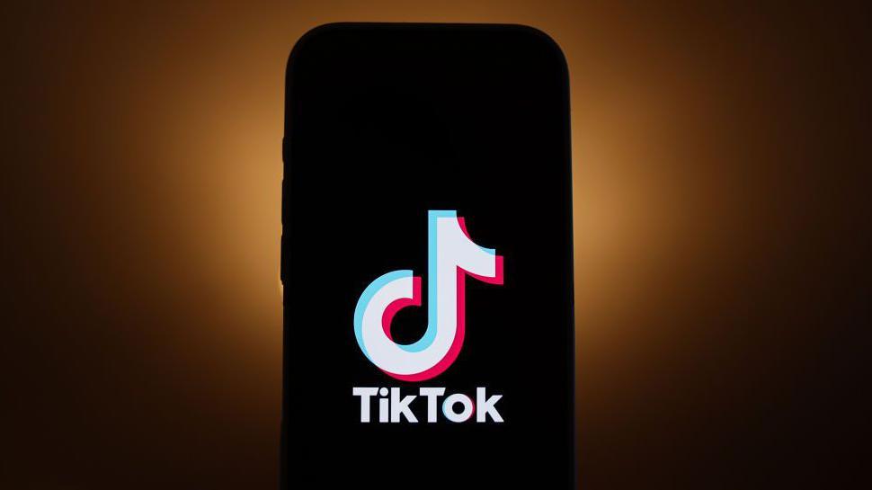 A phone with the TikTok logo