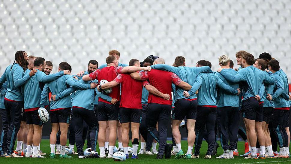 England players in a huddle during training