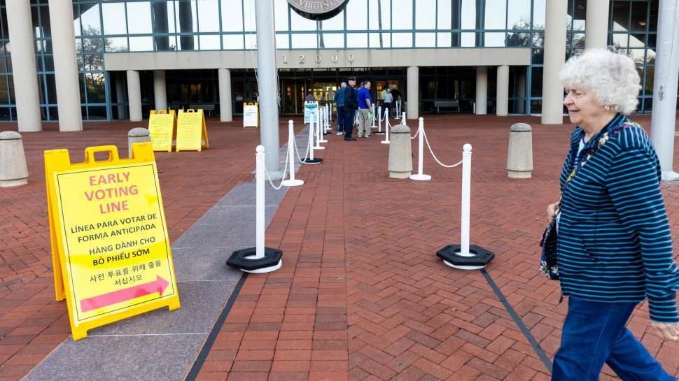 A voter heading to the Fairfax County Government Center polling place in Virginia