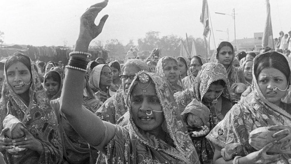 Women from the Marwari community of Hinduism take out a procession, maintaining that the worship of Sati (widow burning on the pyre of her husband) has nothing to do with actual widow sacrifice and asserting that worship is an essential part of their religion, tradition, and cultural identity in New Delhi, November 11, 1987. 