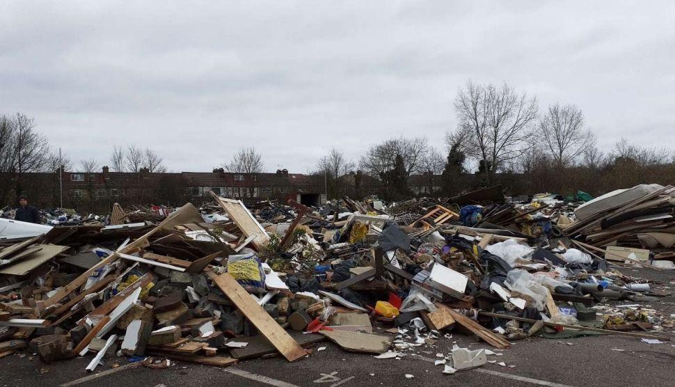 Piles of rubbish inside a derelict car park