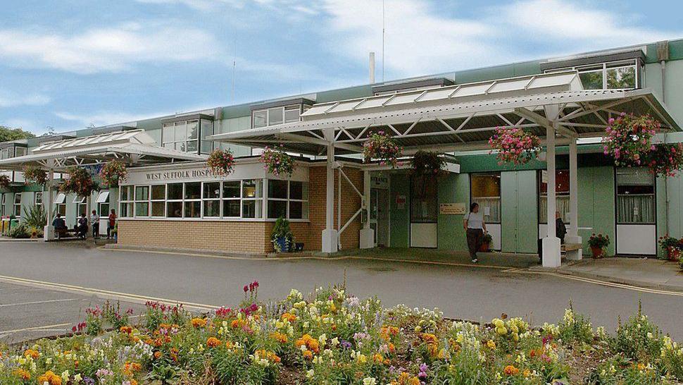 The outside of a the West Suffolk Hospital, a low-rise 1970s building