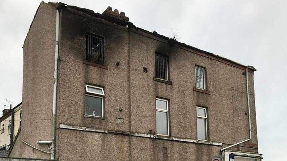 The building on Salthouse Road in Barrow with fire damage around the top windows, after it was hit by a fire in June 2023.