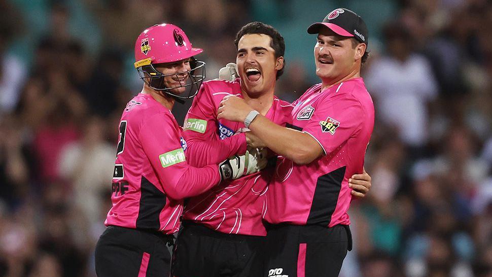 Sydney Sixers players celebrate the dismissal of Hobart Hurricanes' Matthew Wade in the Big Bash League Challenger match in Sydney. Photo by Matt King