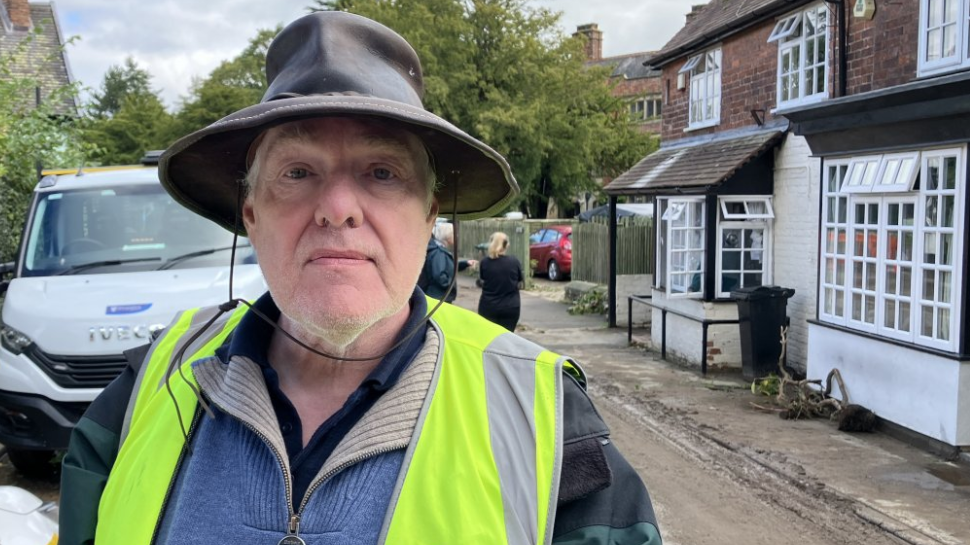 Andy Munro in a hat and high visibility jacket