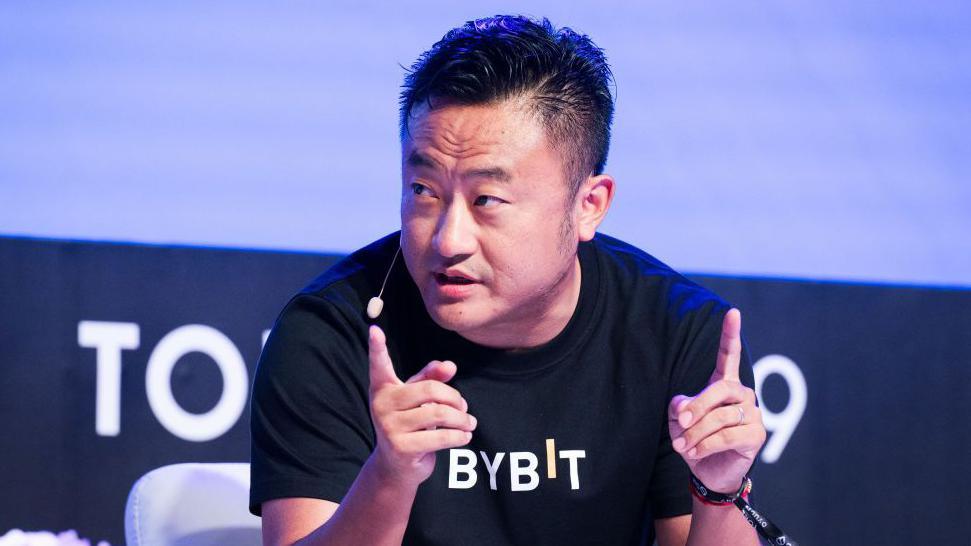 Ben Zhou speaking at a conference