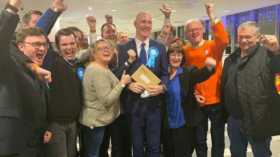 Dr Kieran Mullan and supporters on election night in 2019