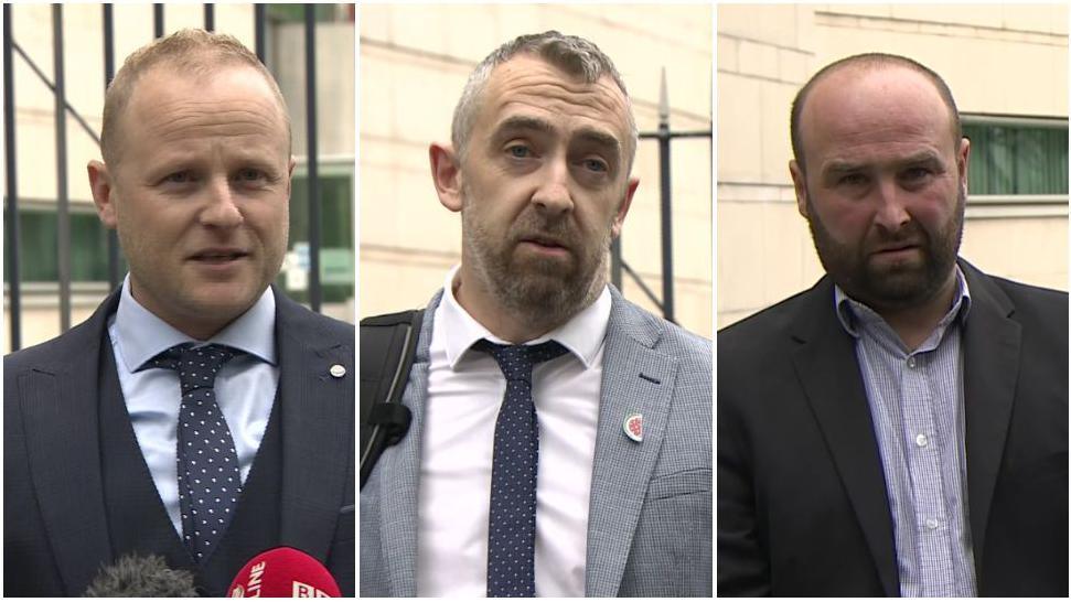 A composite image of Jamie Bryson, Daithí McKay and Thomas O'Hara pictured during separate press conferences outside court on Thursday. Mr McKay has short, greying hair and a beard and is wearing a grey suit. Mr O'Hara has receding dark hair and a beard and is wearing a black suit jacket and a grey shirt.