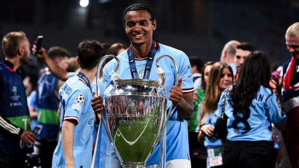 Manchester City defender Manuel Akanji with the Champions League trophy