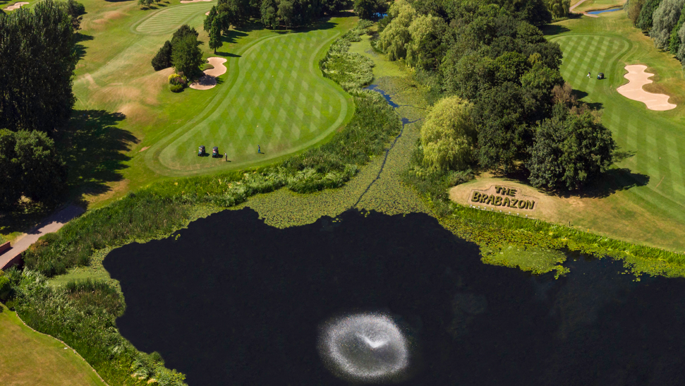 Aerial view of the Brabazon course with a lake.