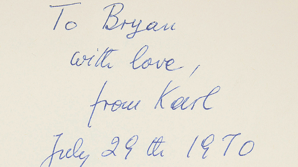A handwritten note by Sir Karl Popper written in blue ink.