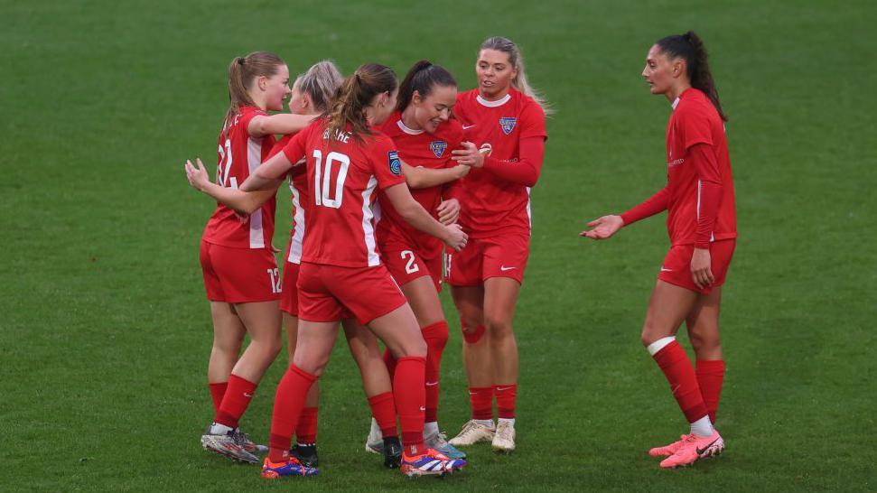 Grace Ayre of Durham celebrates with her teammates after she scores their first goal during The Adobe Women's FA Cup Third Round match between Birmingham City and Durham