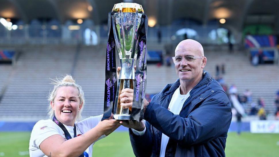 Marlie Packer and John Mitchell with the Six Nations trophy