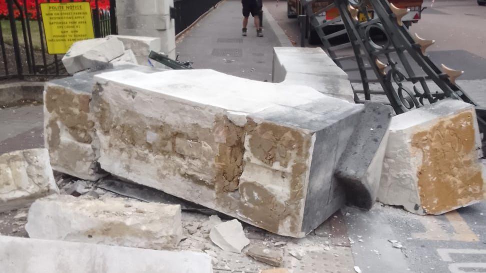 A close-up photo of the stone column, which has broken into smaller rectangular parts.