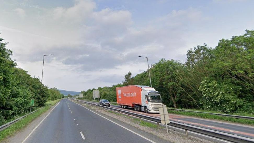 The A629 in North Yorkshire. Pictured is a two-lane carriageway with a clear road ahead, while a lorry and a car travel on the opposite carriageway