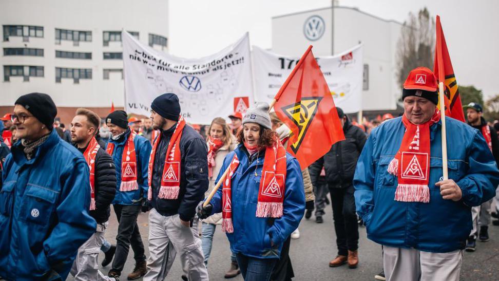 Volkswagen workers marching with banners