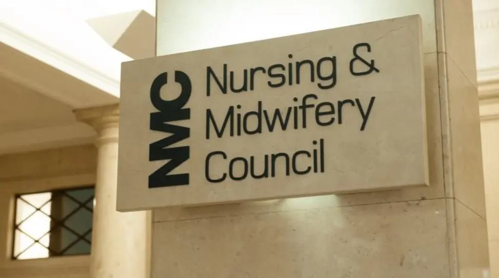 A marble block with the words Nursing and Midwifery Council written on it
