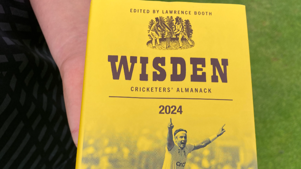 Wisden Cricketers' Almanack 2024, a yellow book with a picture of a cricketer raising his arms in the air