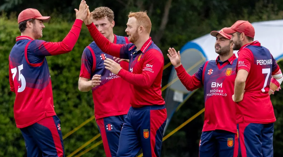 Jersey players celebrate a wicket