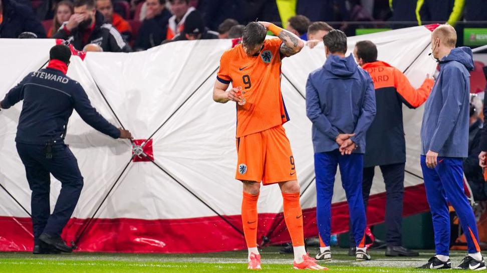 Play is halted during Netherlands' Nations League match against Hungary