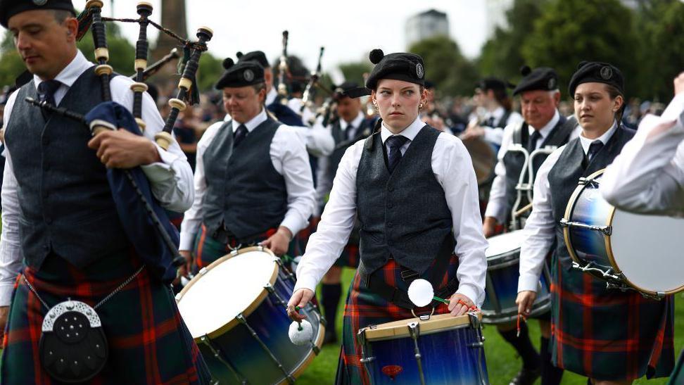 Drummer sternly looks off in the distance during competition