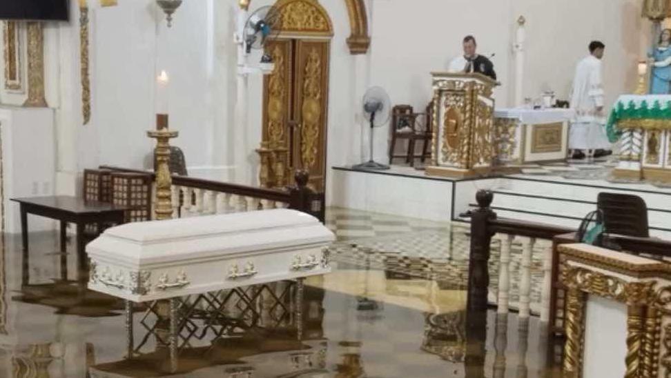 White casket at a church in the Philippines