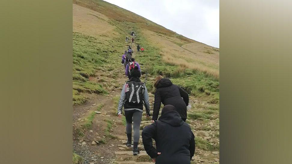 Women climbing Pendle Hill