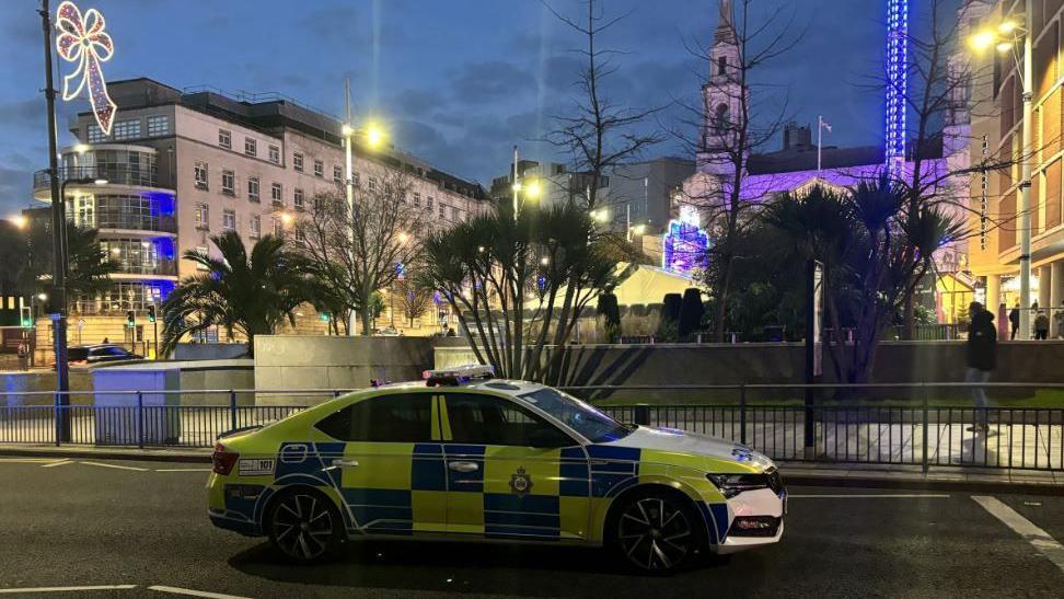 A police car at the scene of the incident